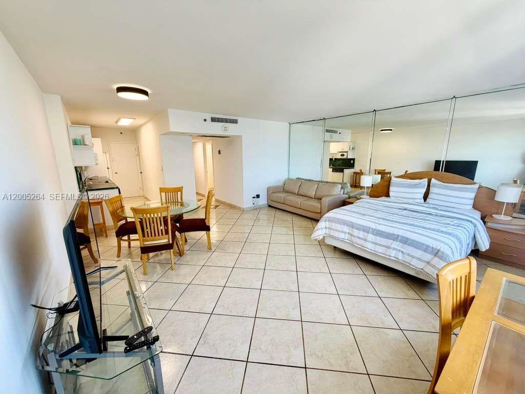 100 Lincoln Road, Unit 731 Miami Beach, FL 33139 - Photo 3 of 12 a bedroom with furniture and natural light