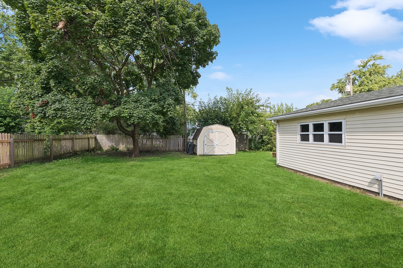 1513 Marquette Road Joliet, IL 60435 - Photo 14 of 16 a view of a backyard with a garden and entertaining space