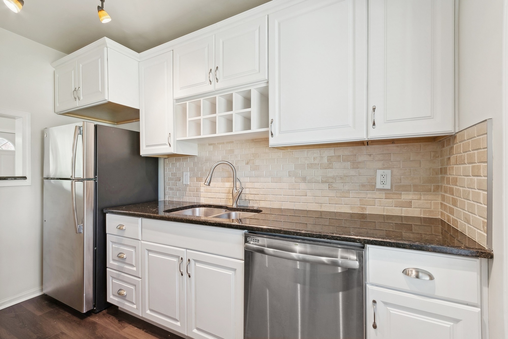 1513 Marquette Road Joliet, IL 60435 - Photo 5 of 16 a kitchen with granite countertop white cabinets white stainless steel appliances and a sink
