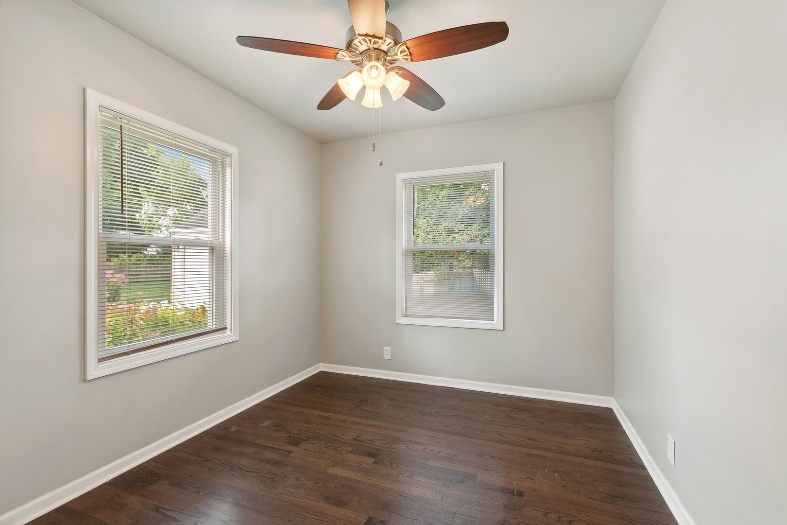 1513 Marquette Road Joliet, IL 60435 - Photo 9 of 16 an empty room with a window and a fan