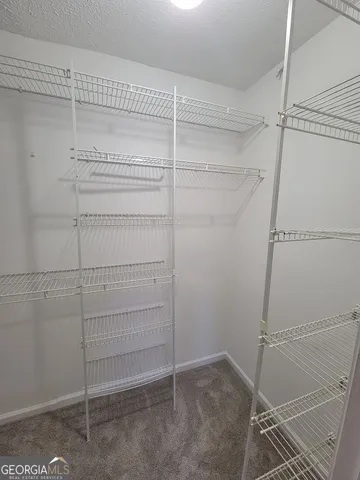 a view of a room with racks on the wall