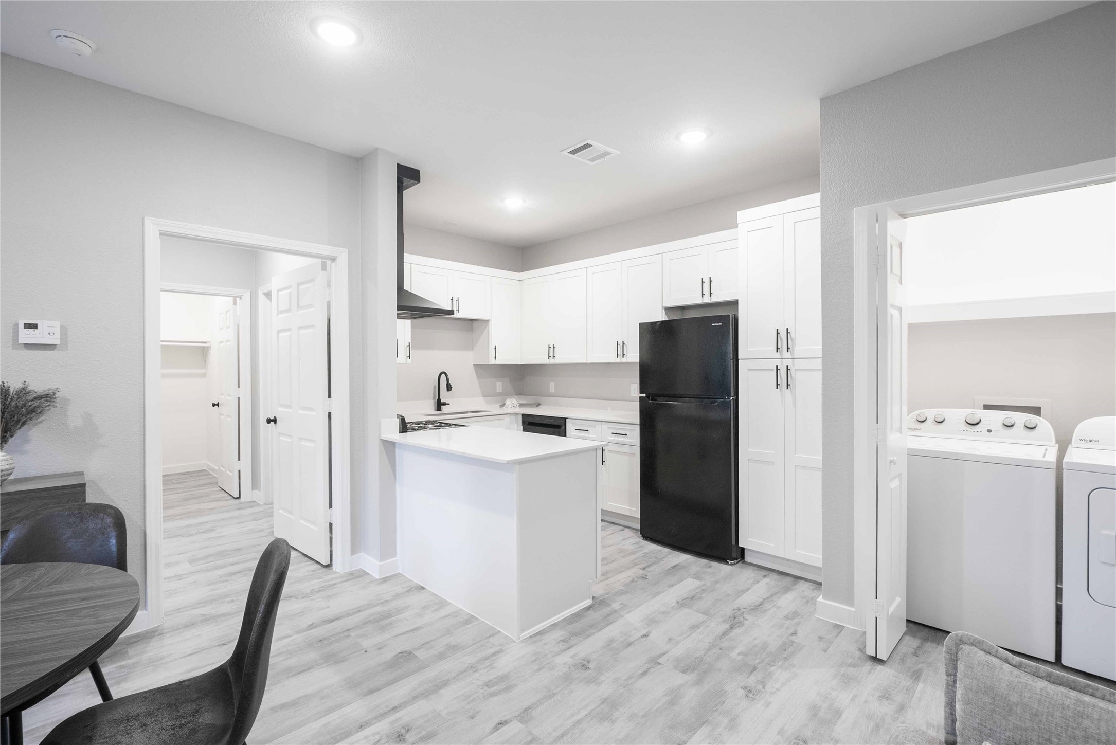 2101 Reinke Road, Unit 8207 Waller, TX 77484 - Photo 4 of 24 a kitchen with a refrigerator a sink and a stove top oven
