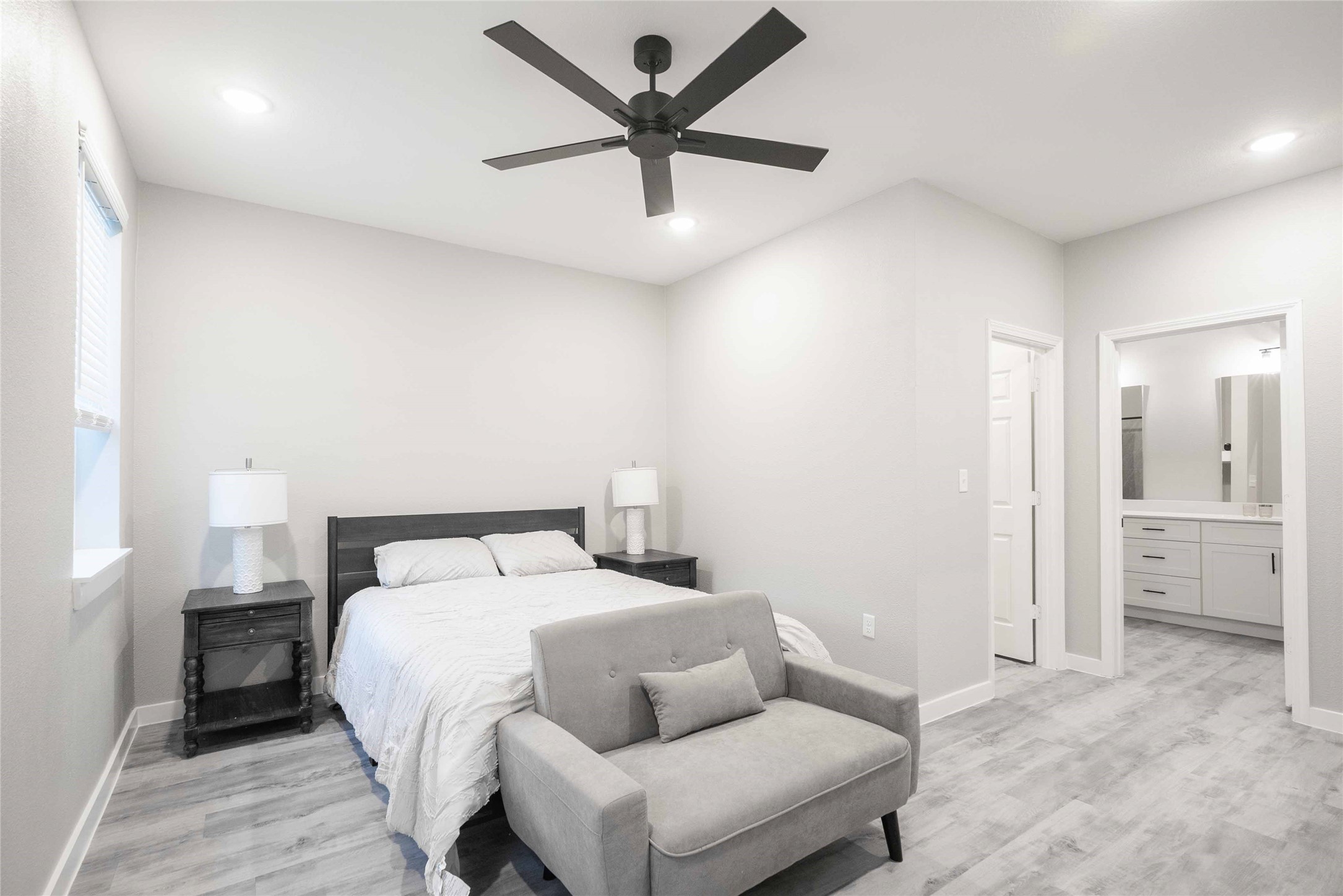 2101 Reinke Road, Unit 8207 Waller, TX 77484 - Photo 8 of 24 a bedroom with a bed and a large window