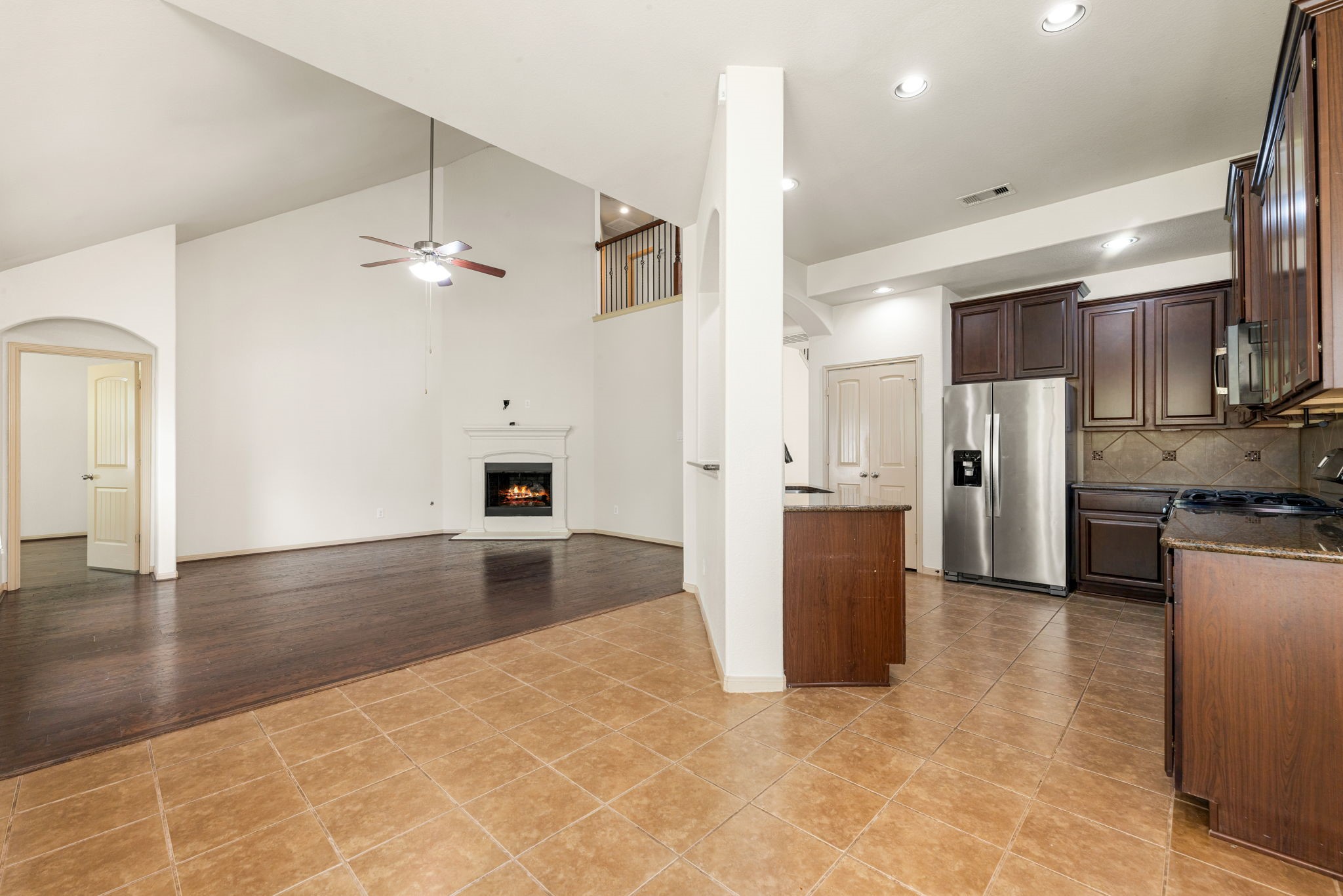 51 Handbridge Place Tomball, TX 77375 - Photo 11 of 46 a view of a kitchen with a sink and a refrigerator