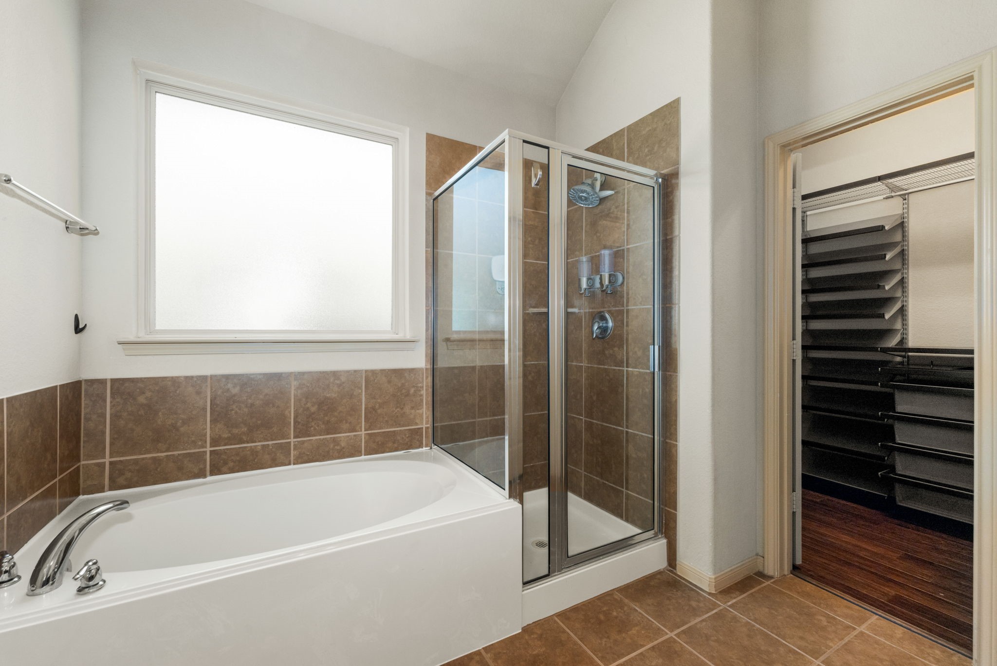 51 Handbridge Place Tomball, TX 77375 - Photo 18 of 46 a bathroom with a bathtub and a shower