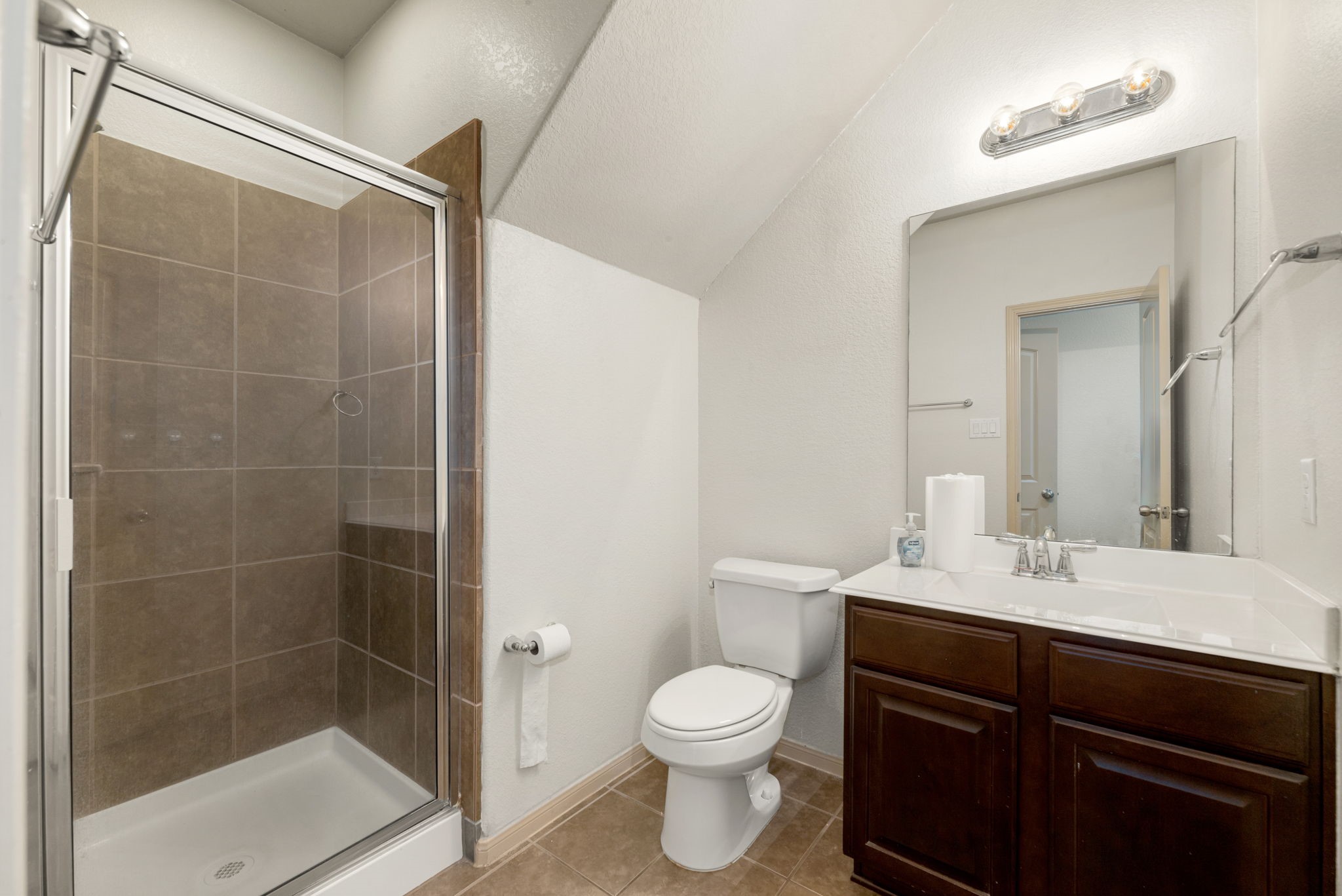 51 Handbridge Place Tomball, TX 77375 - Photo 21 of 46 a bathroom with a sink a toilet and shower