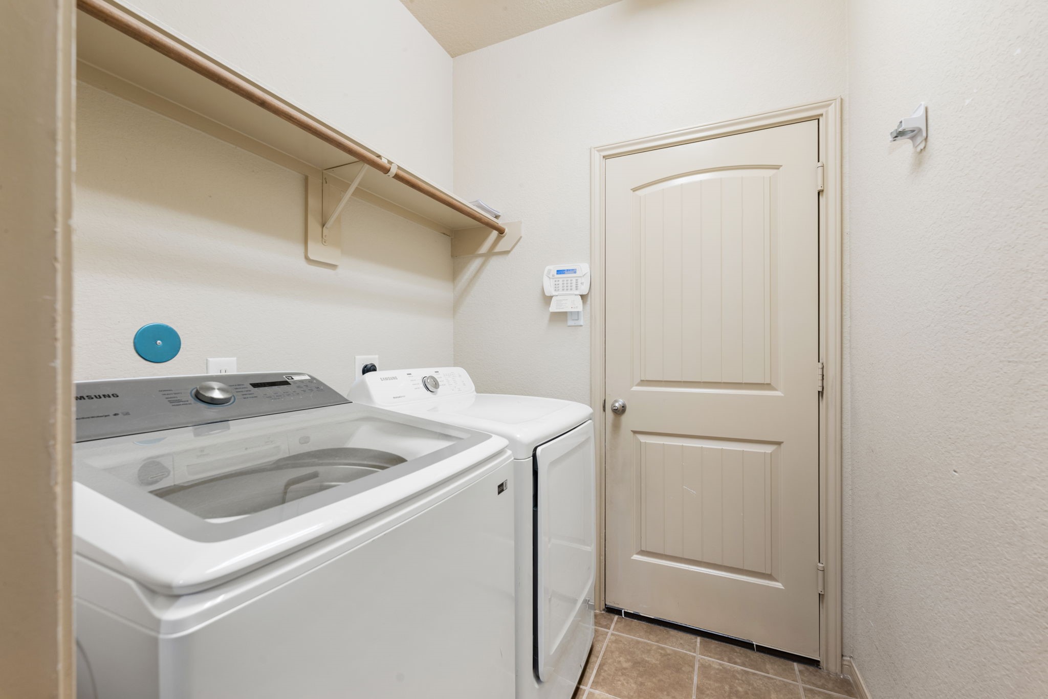 51 Handbridge Place Tomball, TX 77375 - Photo 28 of 46 a utility room with dryer and washer