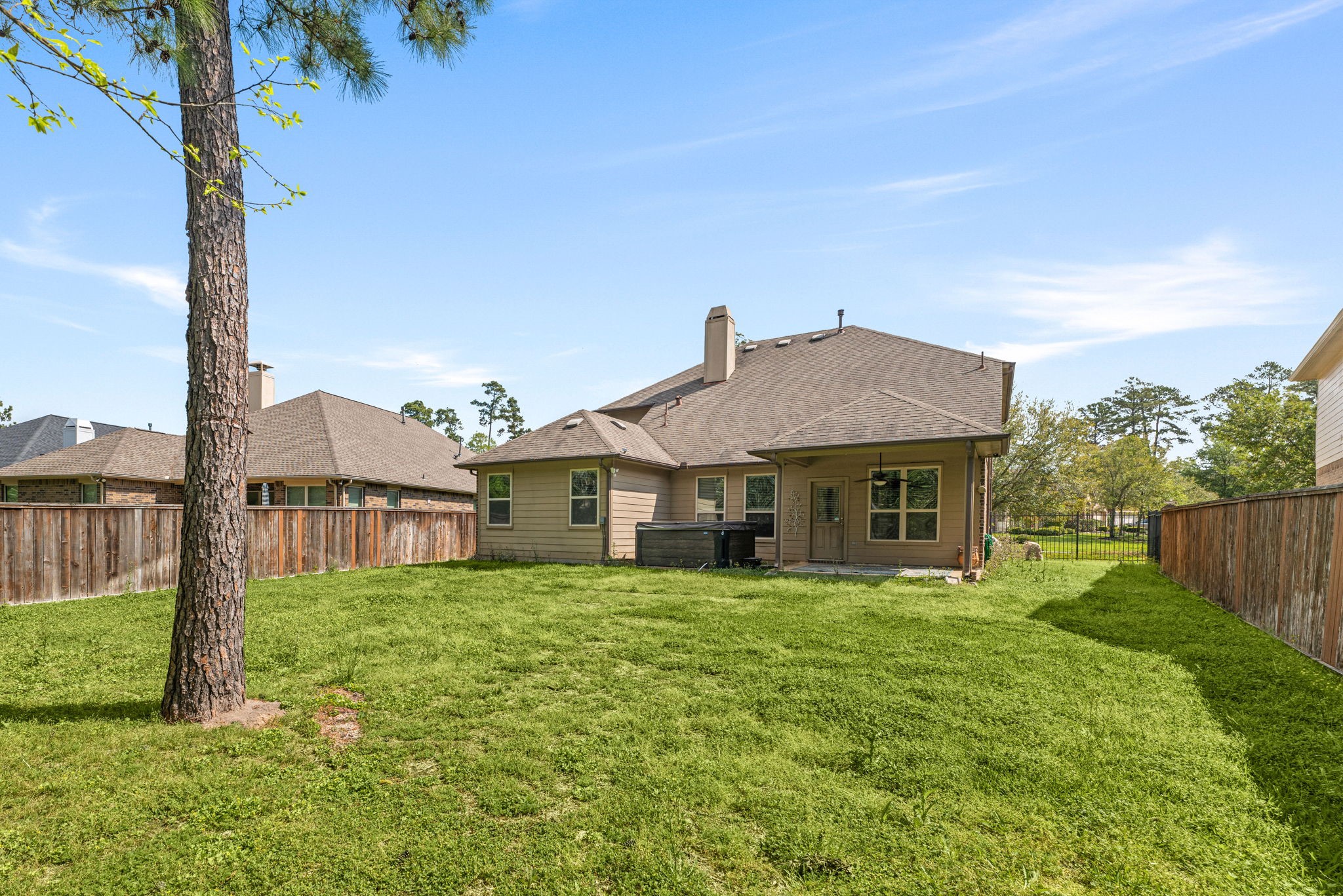 51 Handbridge Place Tomball, TX 77375 - Photo 31 of 46 a view of a house with a yard
