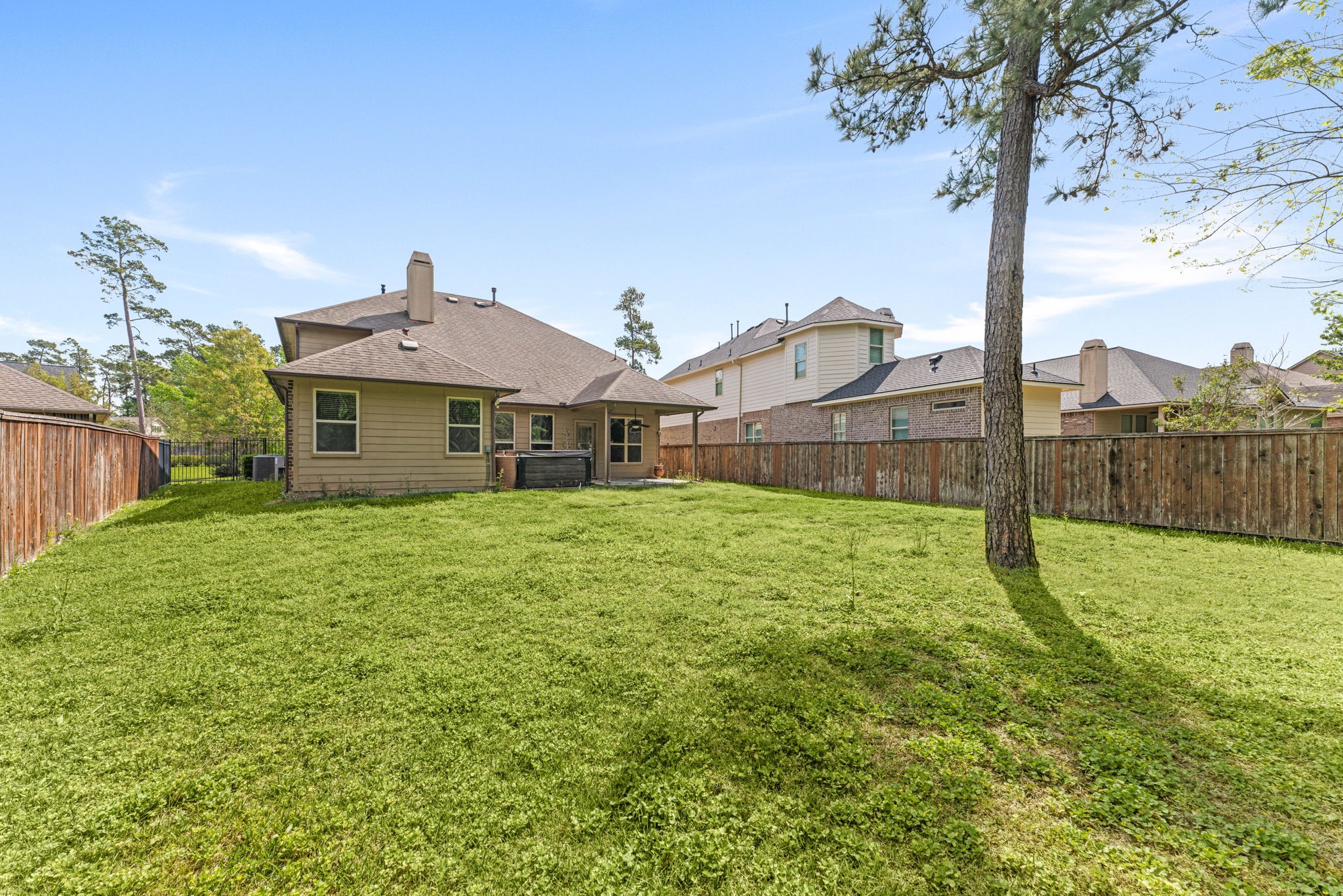 51 Handbridge Place Tomball, TX 77375 - Photo 32 of 46 a view of a house with a yard and plants