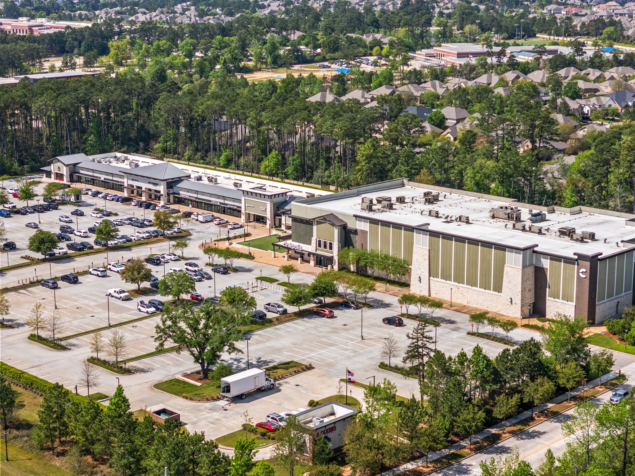 51 Handbridge Place Tomball, TX 77375 - Photo 43 of 46 an aerial view of a building with a lot of trees & street