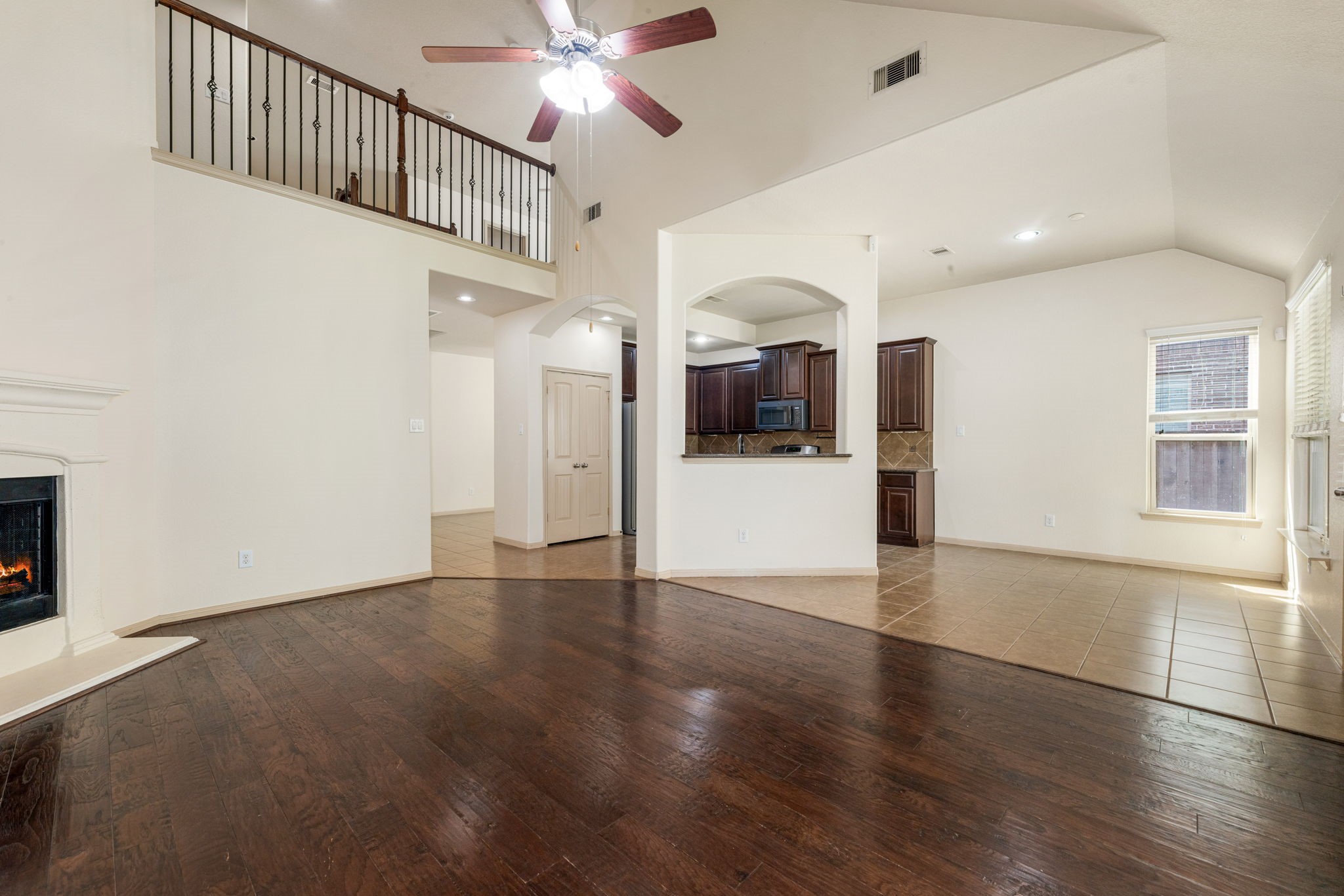 51 Handbridge Place Tomball, TX 77375 - Photo 10 of 46 a view of a hallway with wooden floor and a kitchen
