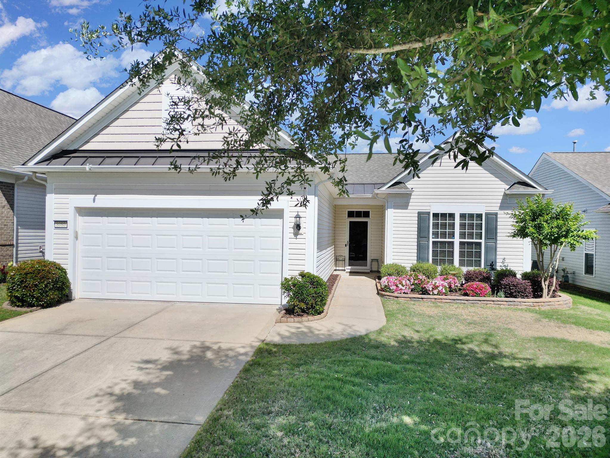 8080 Pawleys Court Fort Mill, SC 29707 - Photo 1 of 44 a front view of a house with a yard
