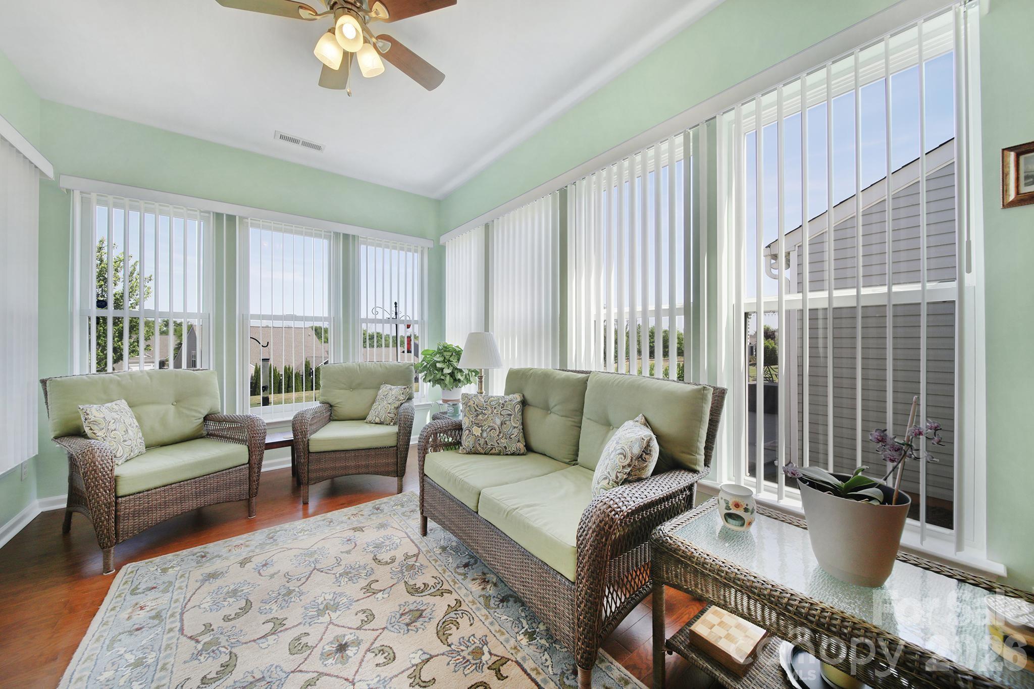 8080 Pawleys Court Fort Mill, SC 29707 - Photo 13 of 44 a living room with furniture and a large window