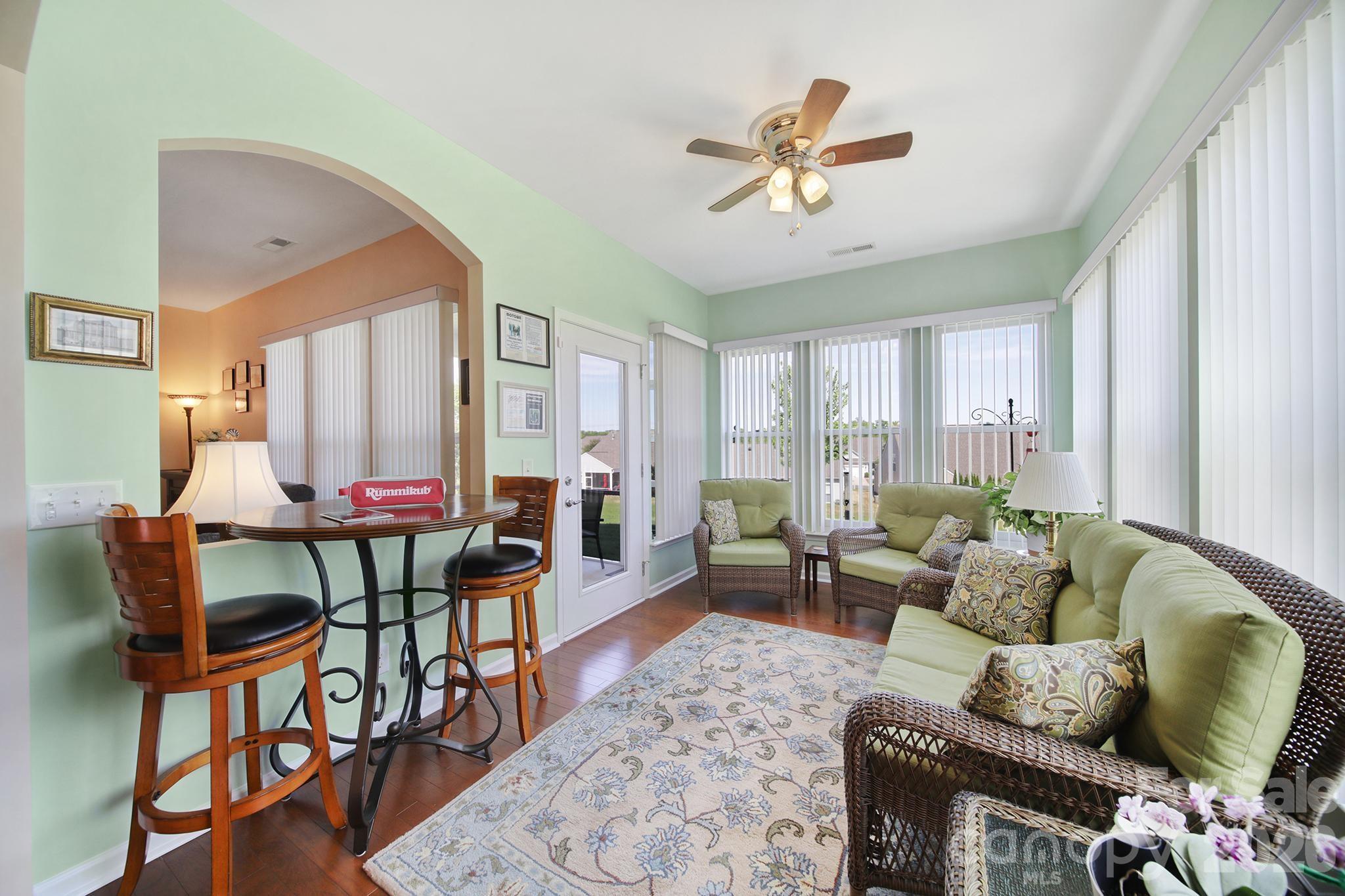 8080 Pawleys Court Fort Mill, SC 29707 - Photo 14 of 44 a living room with furniture and a large window