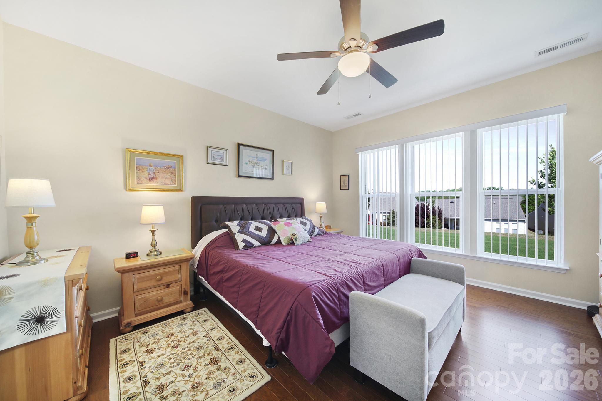 8080 Pawleys Court Fort Mill, SC 29707 - Photo 16 of 44 a bedroom with a large bed and a window