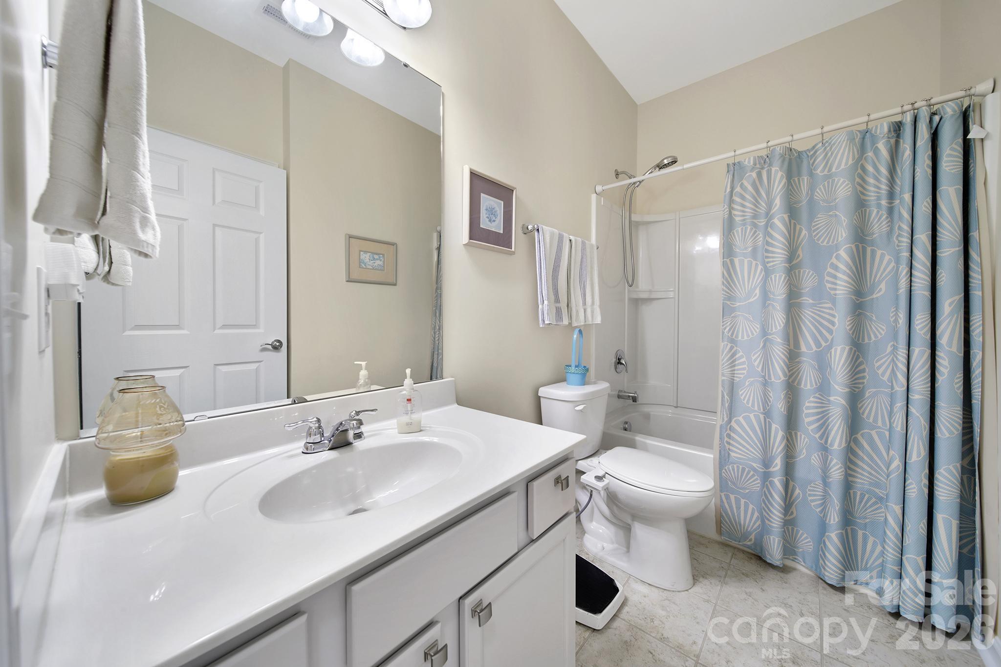 8080 Pawleys Court Fort Mill, SC 29707 - Photo 23 of 44 a bathroom with a sink toilet and shower