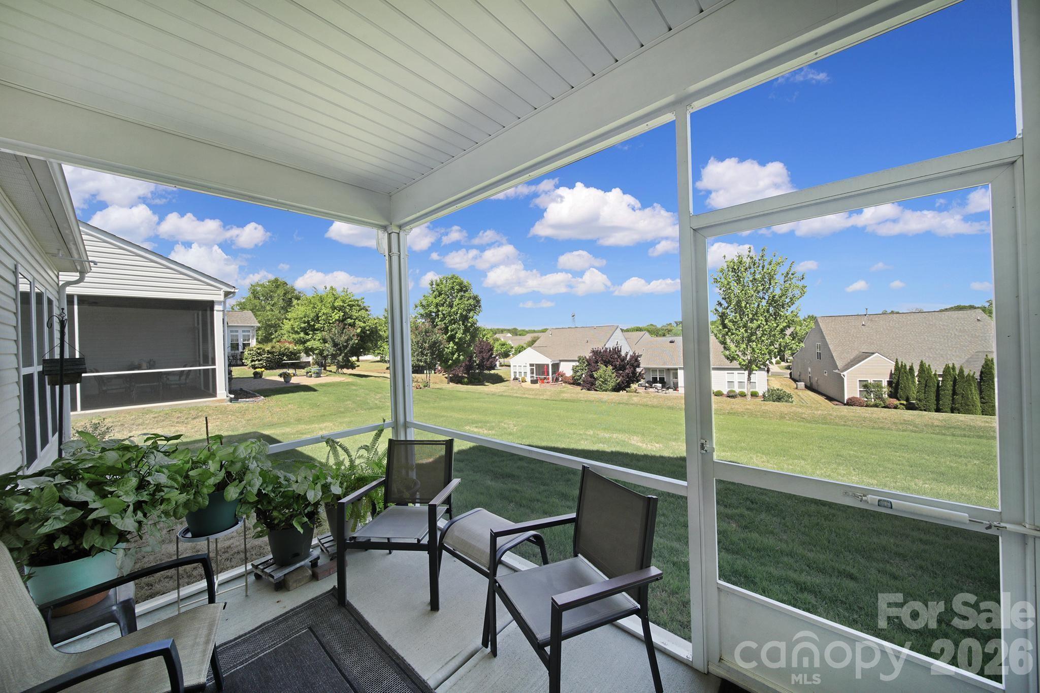 8080 Pawleys Court Fort Mill, SC 29707 - Photo 25 of 44 a view of a porch with furniture and garden