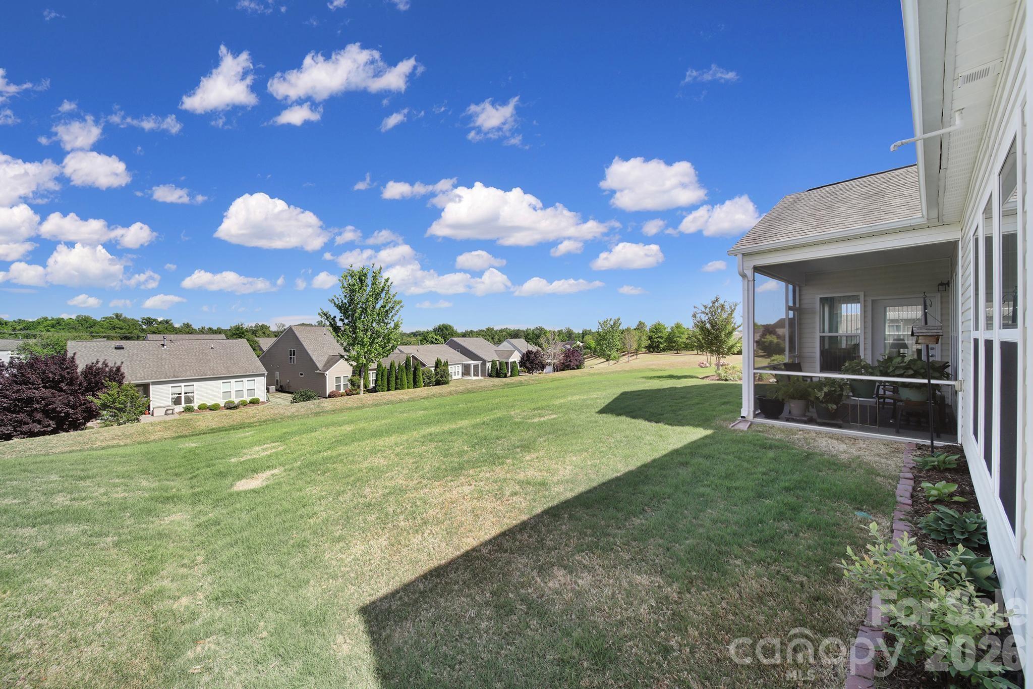 8080 Pawleys Court Fort Mill, SC 29707 - Photo 27 of 44 a view of a house with a backyard