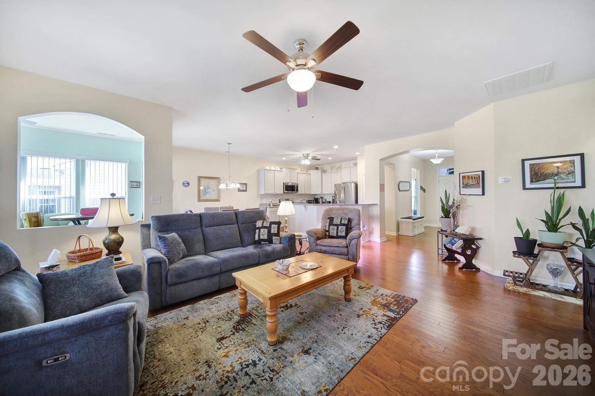 8080 Pawleys Court Fort Mill, SC 29707 - Photo 4 of 44 a living room with furniture and wooden floor