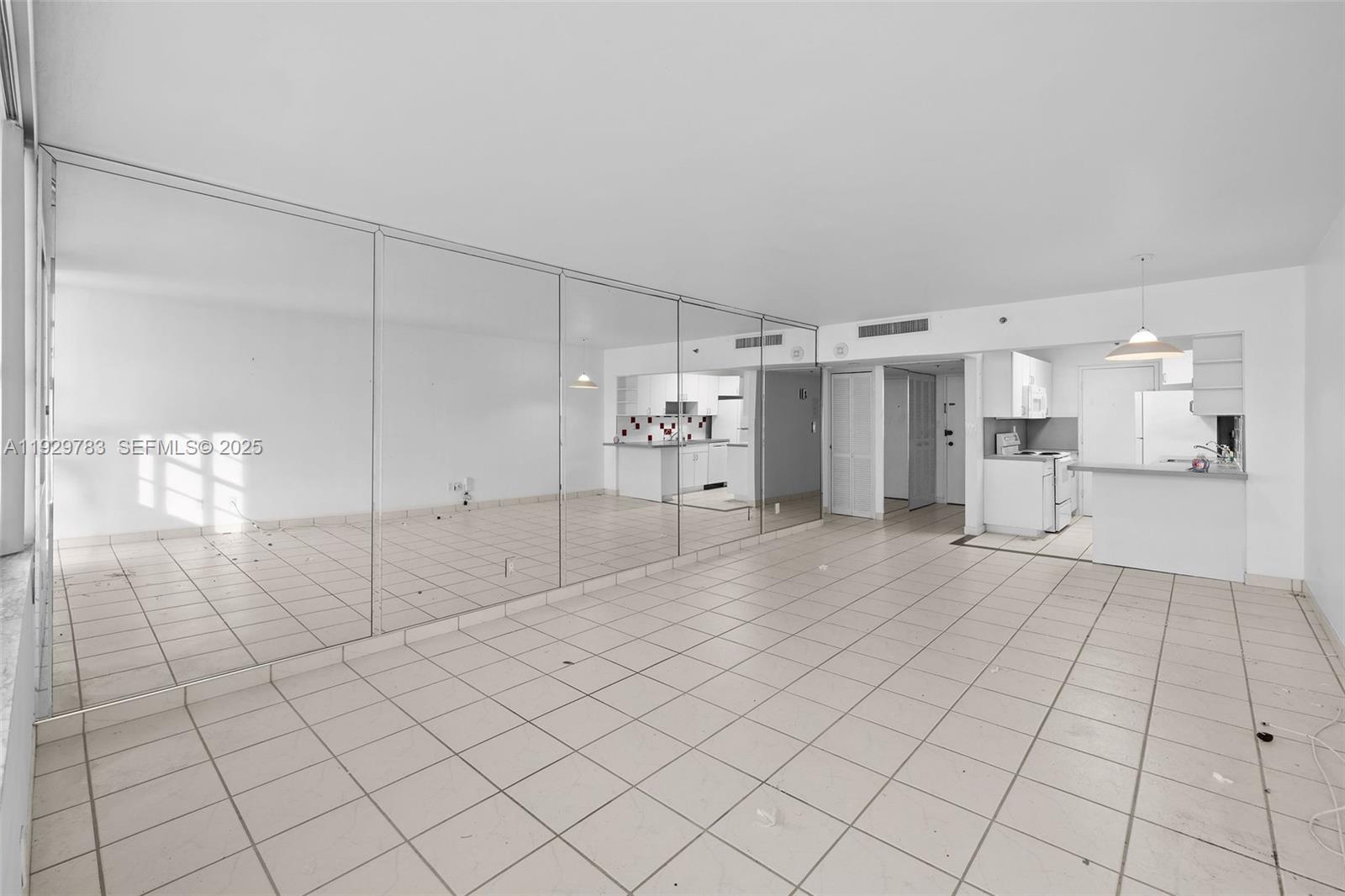 100 Lincoln Road, Unit 1444 Miami Beach, FL 33139 - Photo 11 of 38 a view of a electric appliances and cabinets in a room