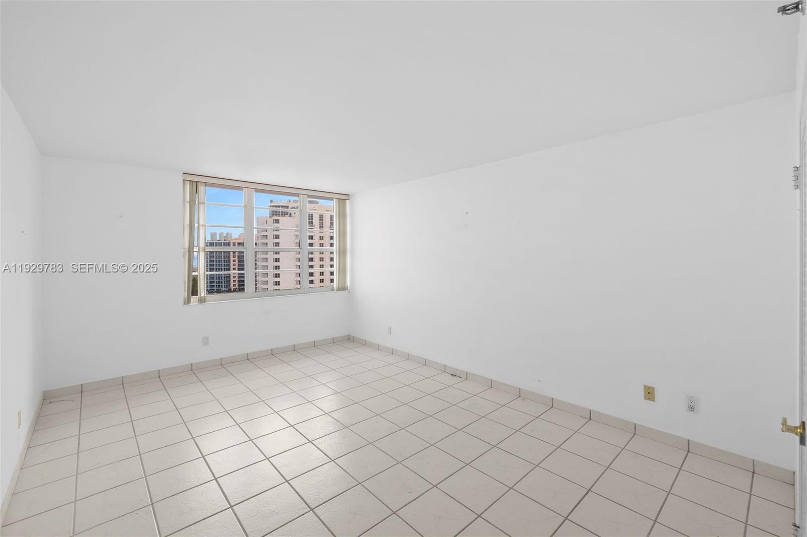 100 Lincoln Road, Unit 1444 Miami Beach, FL 33139 - Photo 17 of 38 an empty room with windows