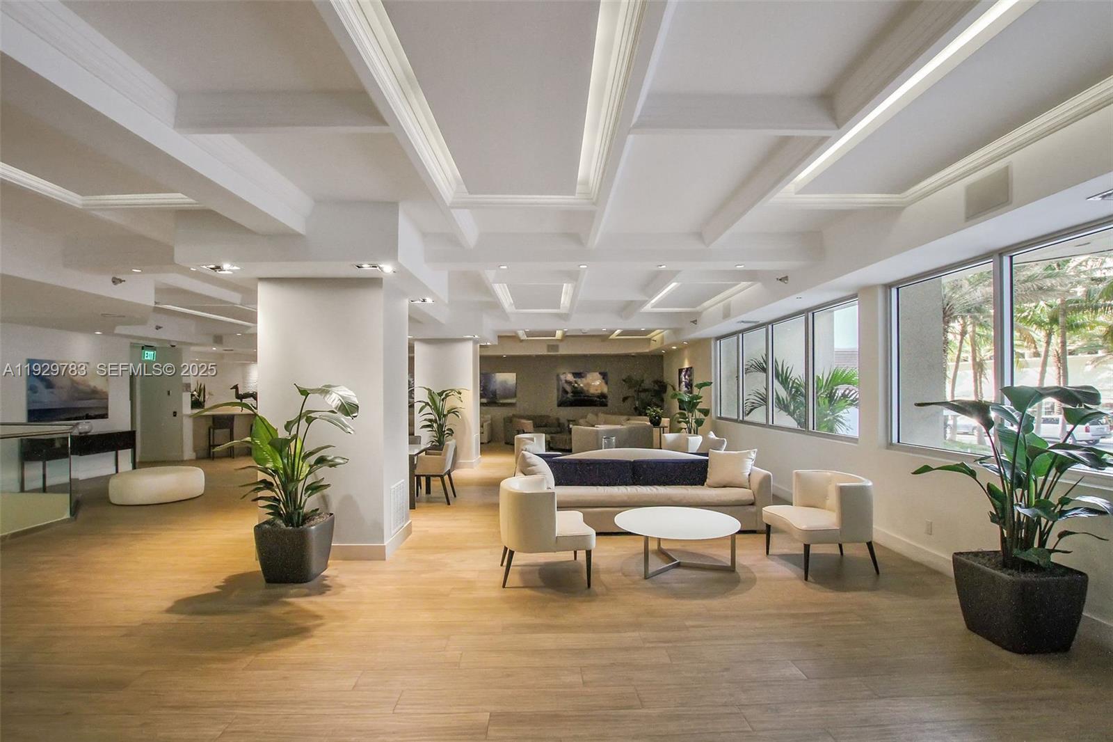 100 Lincoln Road, Unit 1444 Miami Beach, FL 33139 - Photo 28 of 38 a living room with furniture potted plant floor to ceiling window and potted plant