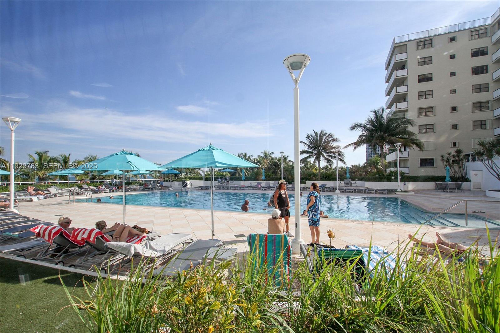 100 Lincoln Road, Unit 1444 Miami Beach, FL 33139 - Photo 31 of 38 a view of a swimming pool with a lake view