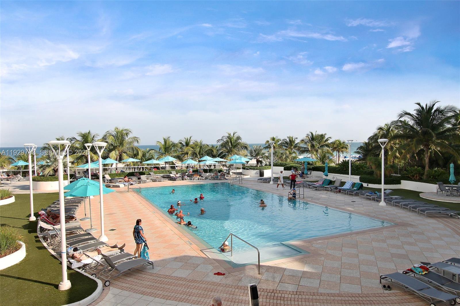 100 Lincoln Road, Unit 1444 Miami Beach, FL 33139 - Photo 37 of 38 a view of a swimming pool with a patio