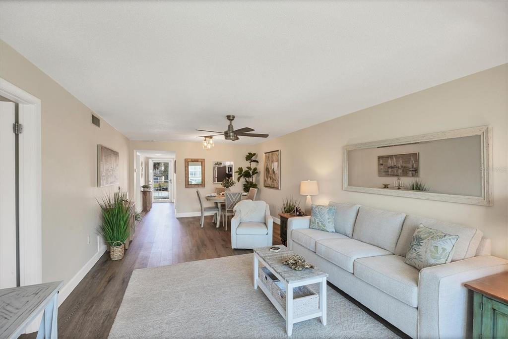 210 Santa Maria Street, Unit 248 Venice, FL 34285 - Photo 11 of 72 a living room with furniture and wooden floor