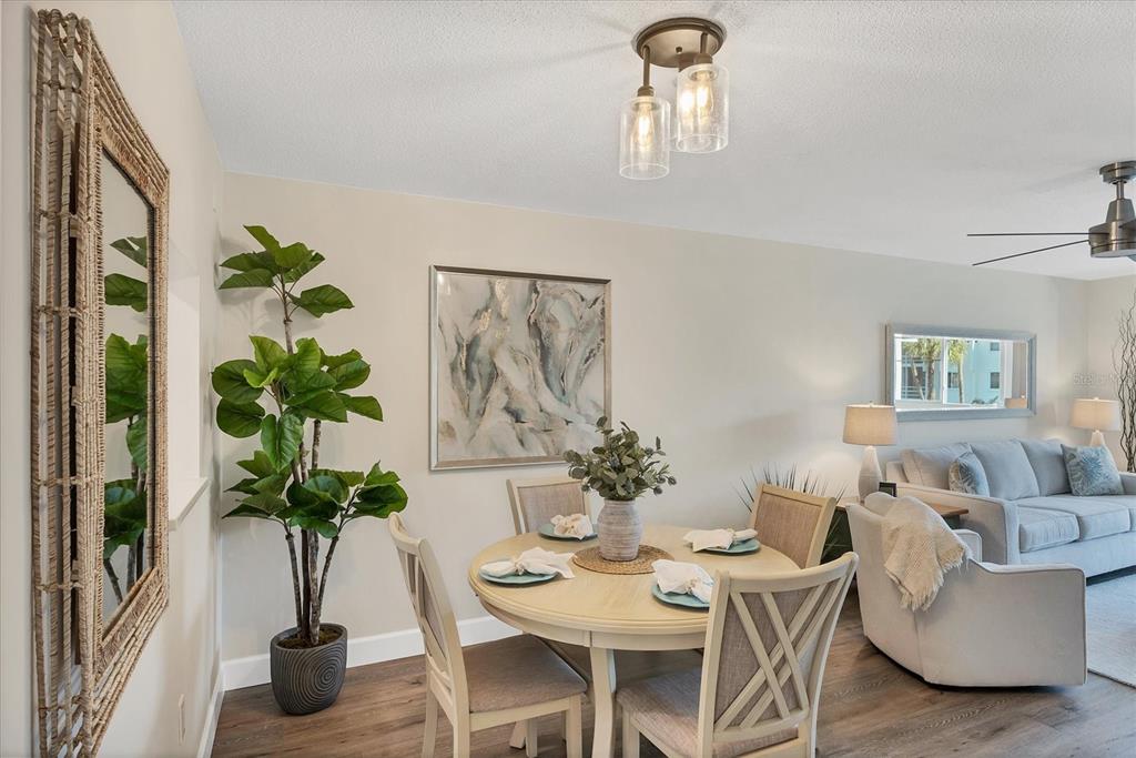 210 Santa Maria Street, Unit 248 Venice, FL 34285 - Photo 13 of 72 a living room with furniture flowers and a potted plant