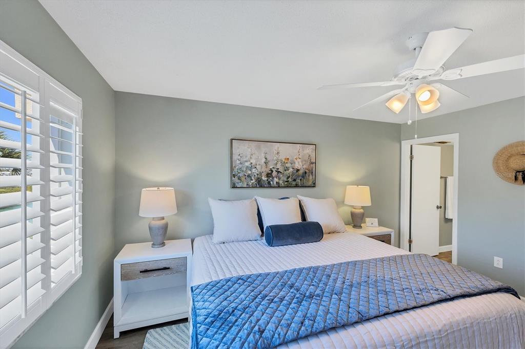 210 Santa Maria Street, Unit 248 Venice, FL 34285 - Photo 17 of 72 a bedroom with a bed and wooden floor