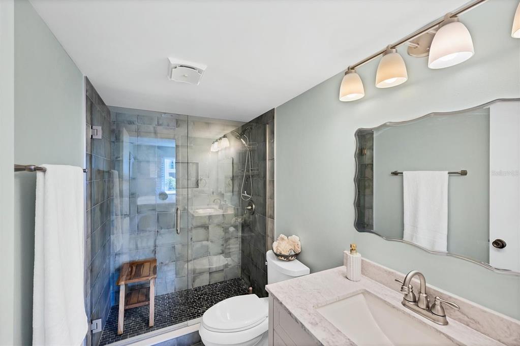 210 Santa Maria Street, Unit 248 Venice, FL 34285 - Photo 21 of 72 a bathroom with a sink a toilet and shower