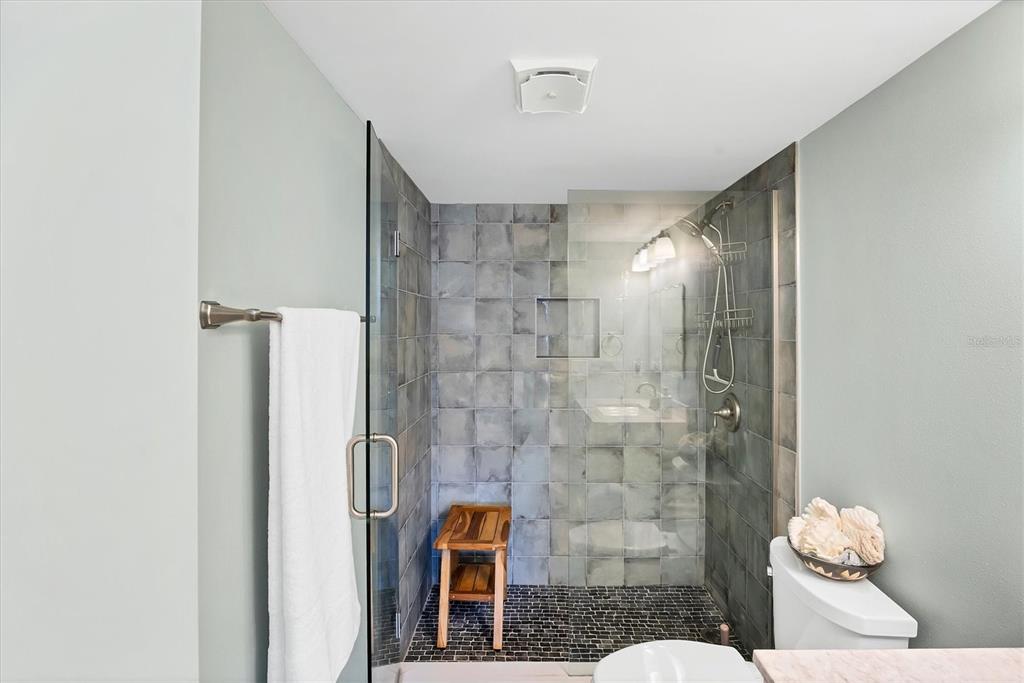 210 Santa Maria Street, Unit 248 Venice, FL 34285 - Photo 22 of 72 a bathroom with a granite countertop shower and a sink