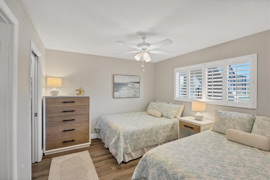 210 Santa Maria Street, Unit 248 Venice, FL 34285 - Photo 25 of 72 a bedroom with two beds and a window