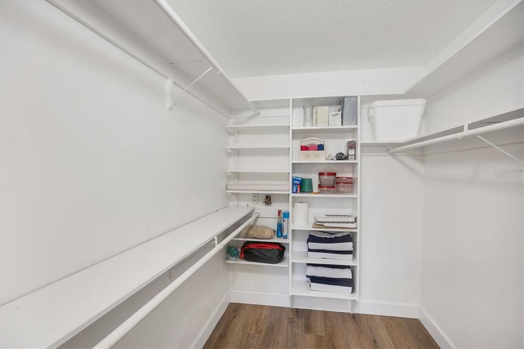 210 Santa Maria Street, Unit 248 Venice, FL 34285 - Photo 27 of 72 a view of walk in closet with empty racks