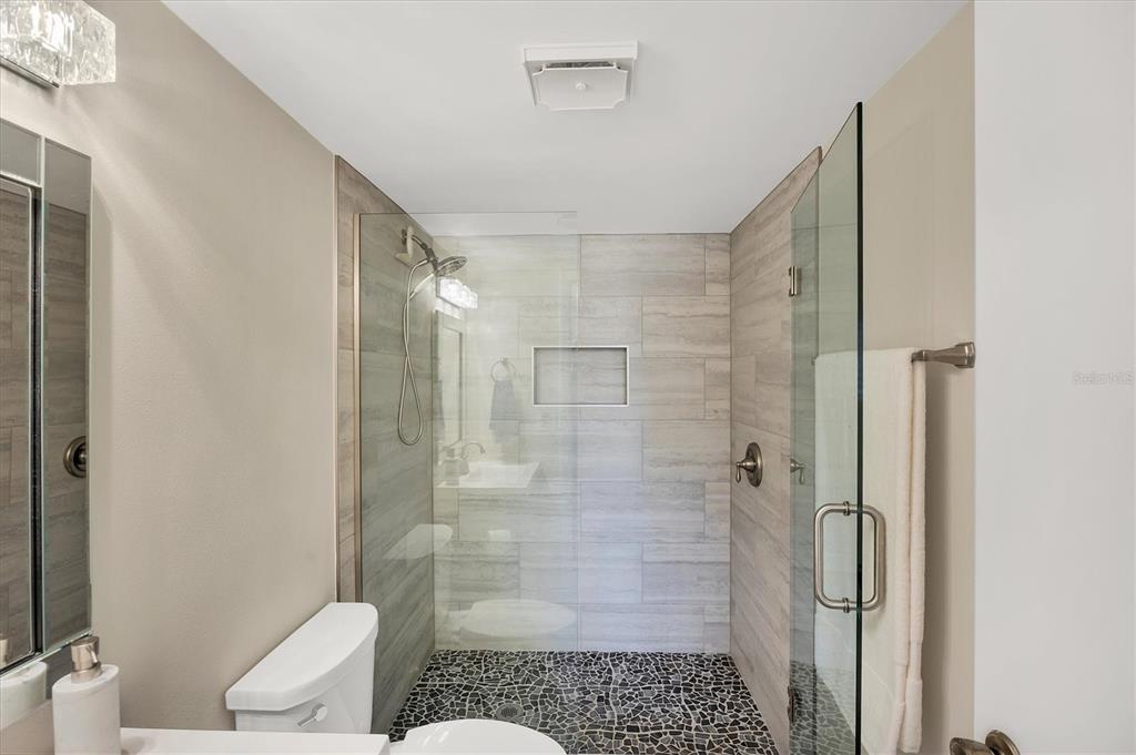 210 Santa Maria Street, Unit 248 Venice, FL 34285 - Photo 29 of 72 a bathroom with a shower and a toilet