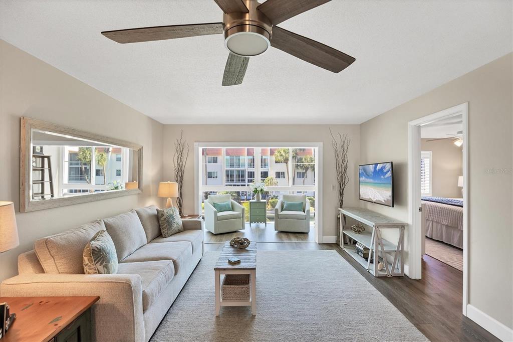 210 Santa Maria Street, Unit 248 Venice, FL 34285 - Photo 4 of 72 a living room with furniture and a flat screen tv