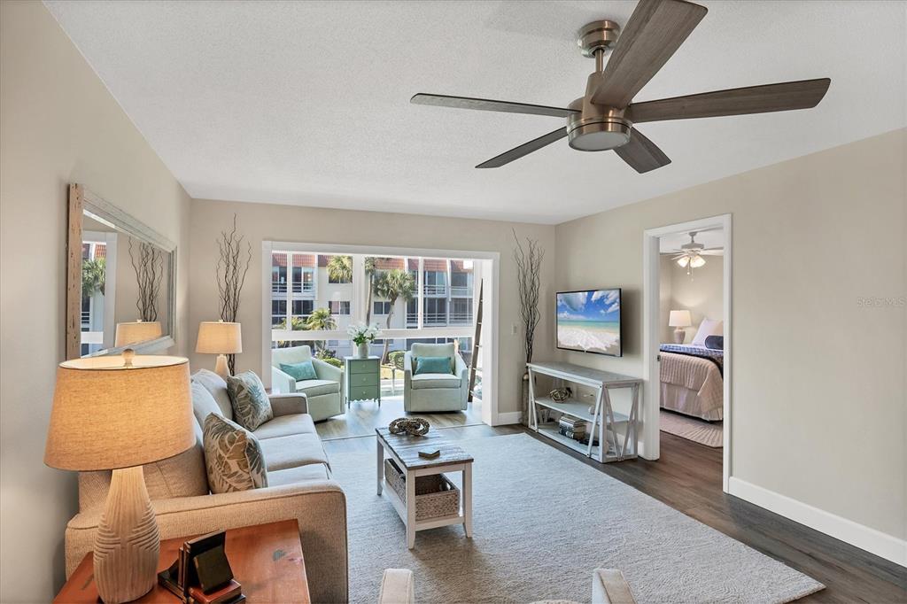 210 Santa Maria Street, Unit 248 Venice, FL 34285 - Photo 5 of 72 a living room with furniture and a flat screen tv
