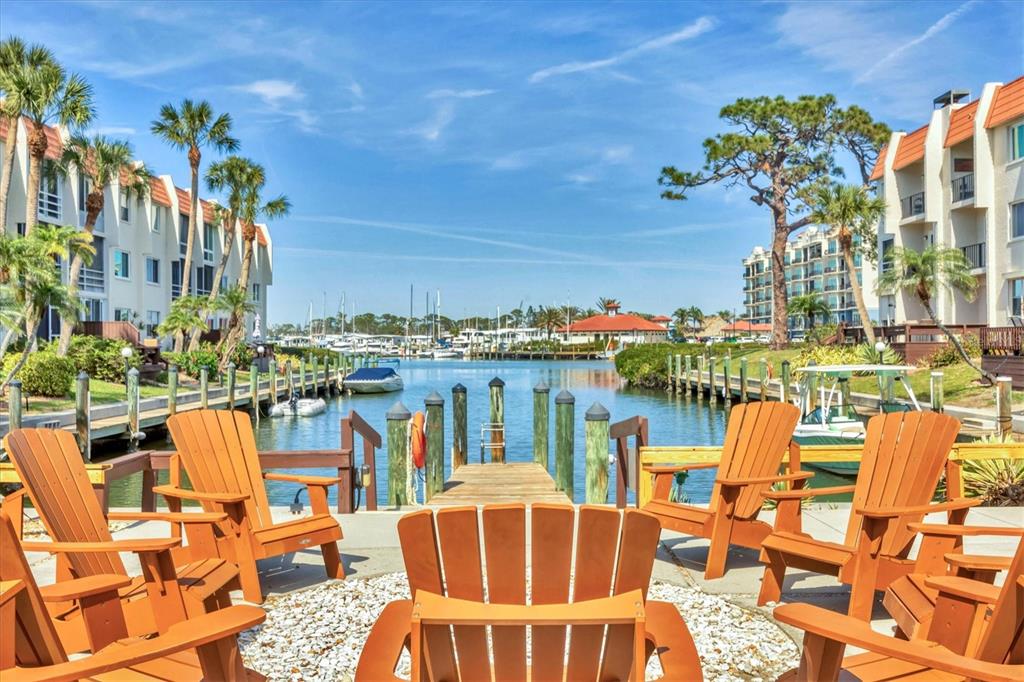 210 Santa Maria Street, Unit 248 Venice, FL 34285 - Photo 63 of 72 a view of a chairs and table on the terrace