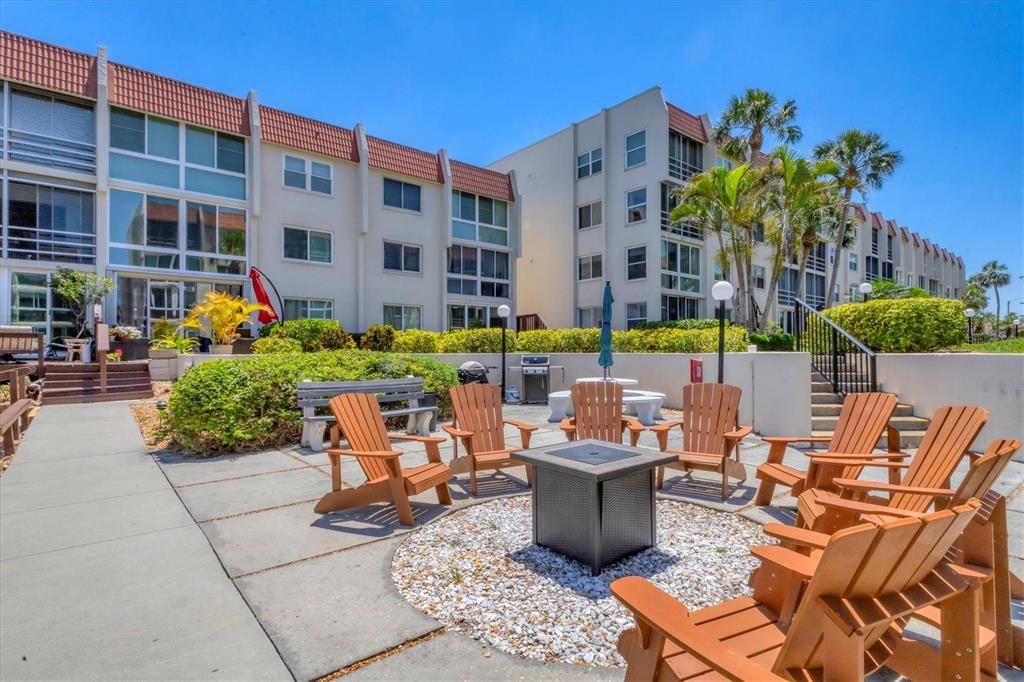 210 Santa Maria Street, Unit 248 Venice, FL 34285 - Photo 64 of 72 a group of table sitting in front of building