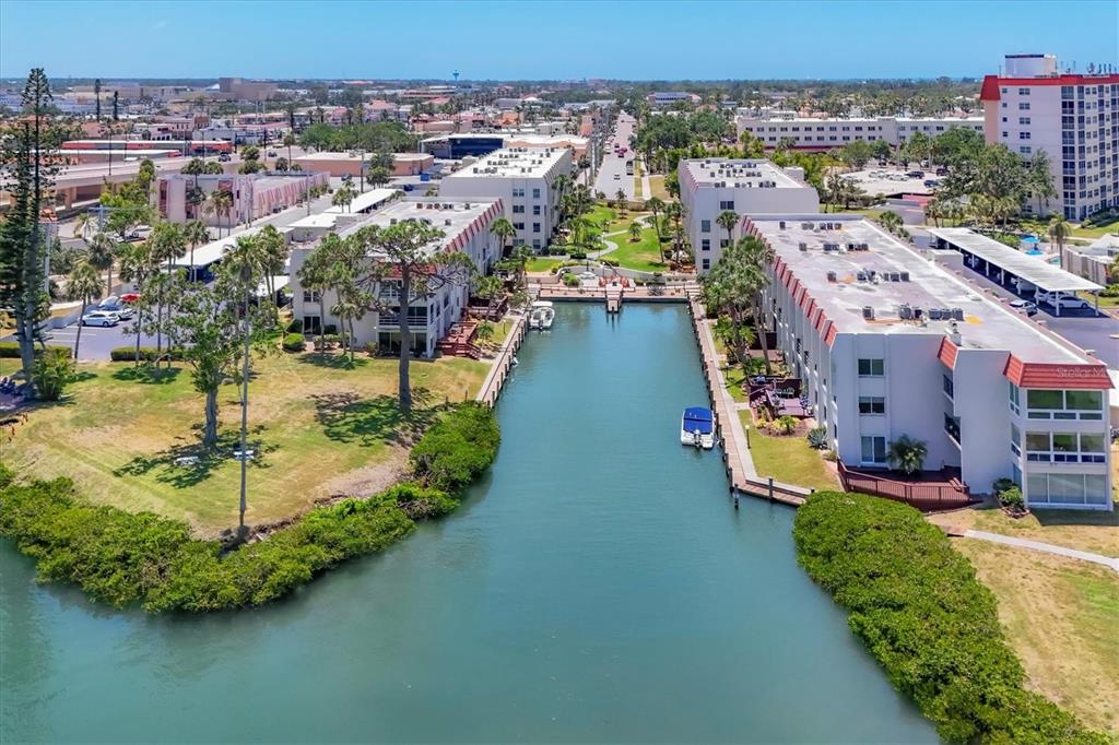 210 Santa Maria Street, Unit 248 Venice, FL 34285 - Photo 72 of 72 an aerial view of a house with a garden and lake view