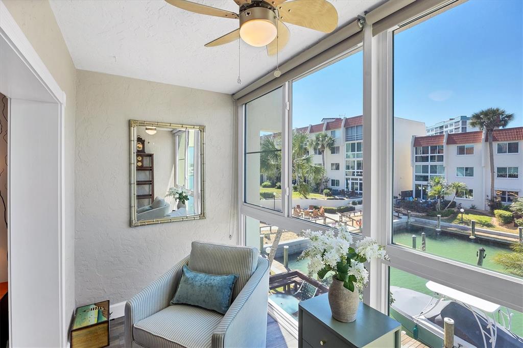 210 Santa Maria Street, Unit 248 Venice, FL 34285 - Photo 9 of 72 a living room with furniture and a floor to ceiling window