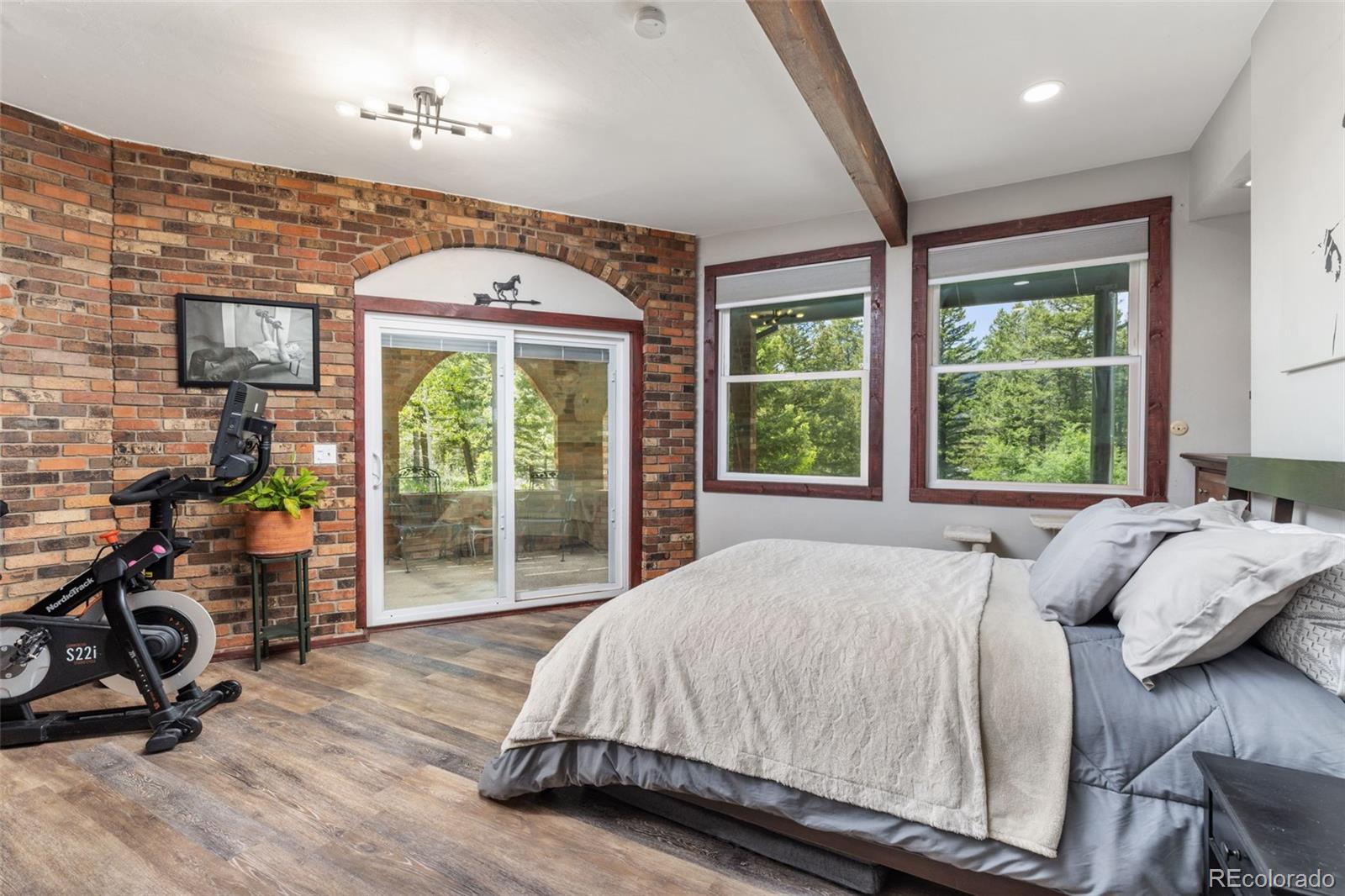 173 Silver Cloud Lane Boulder, CO 80302 - Photo 25 of 43 a bed sitting in a bedroom next to a window