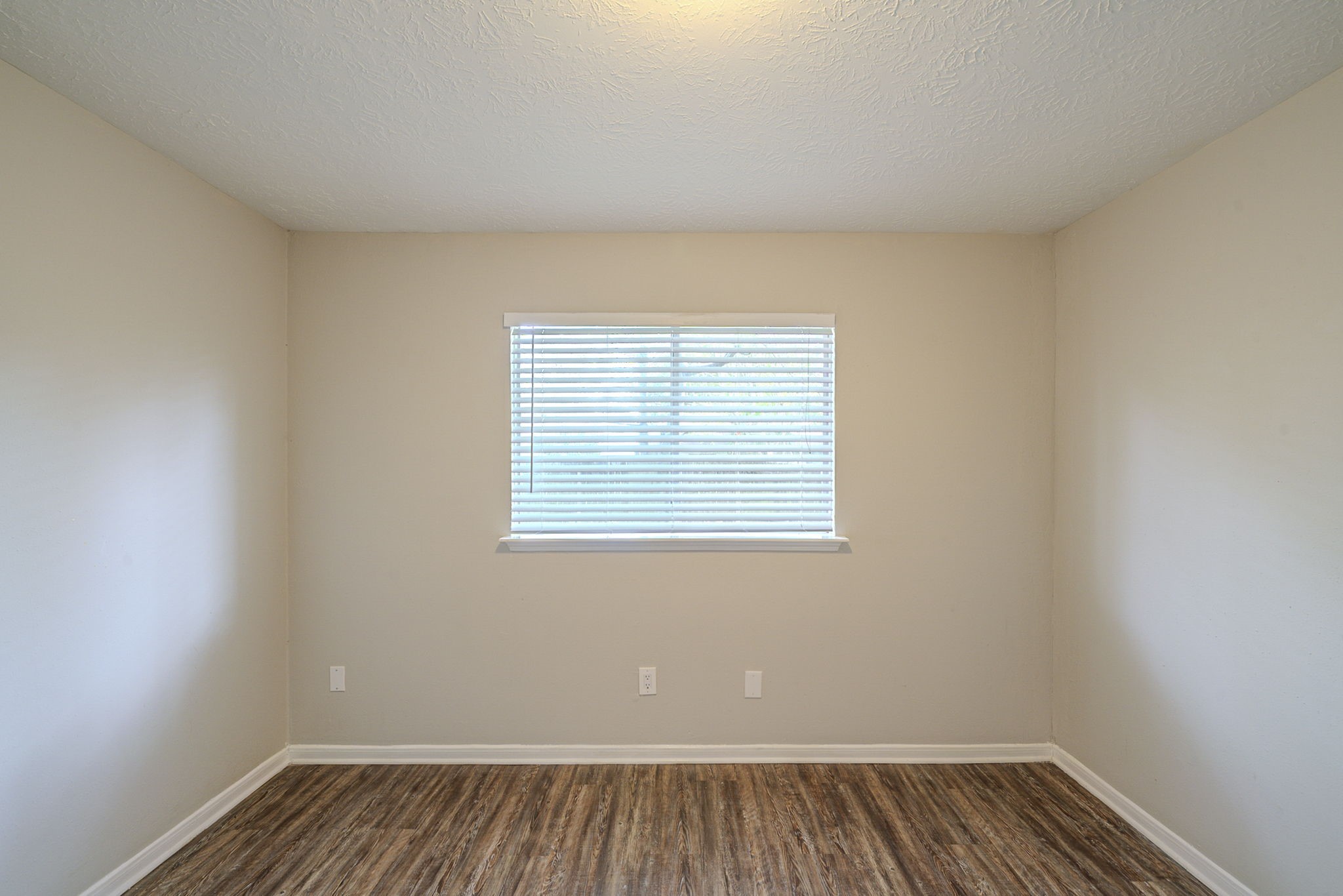 4127 Adonis Drive Spring, TX 77373 - Photo 14 of 20 a view of an empty room with wooden floor and a window