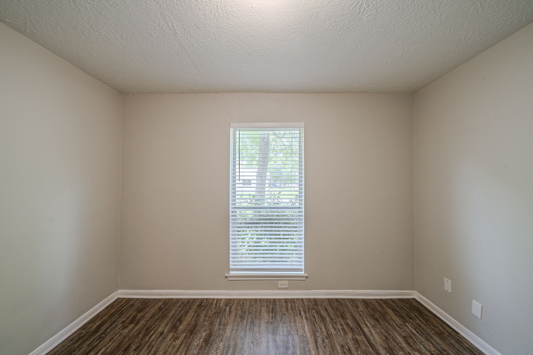 4127 Adonis Drive Spring, TX 77373 - Photo 16 of 20 a view of a room with wooden floor and window