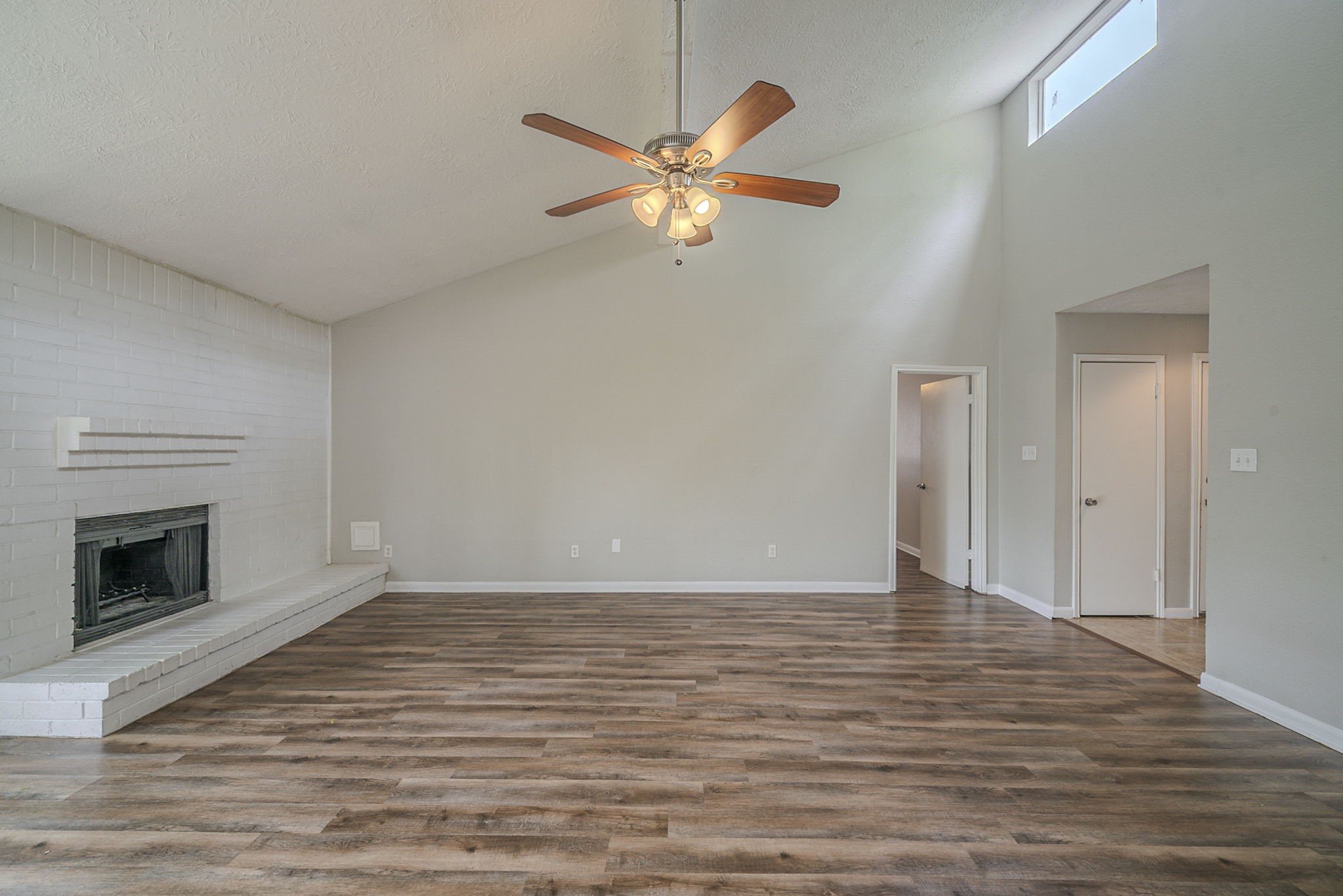 4127 Adonis Drive Spring, TX 77373 - Photo 4 of 20 a view of an empty room with wooden floor and a fireplace