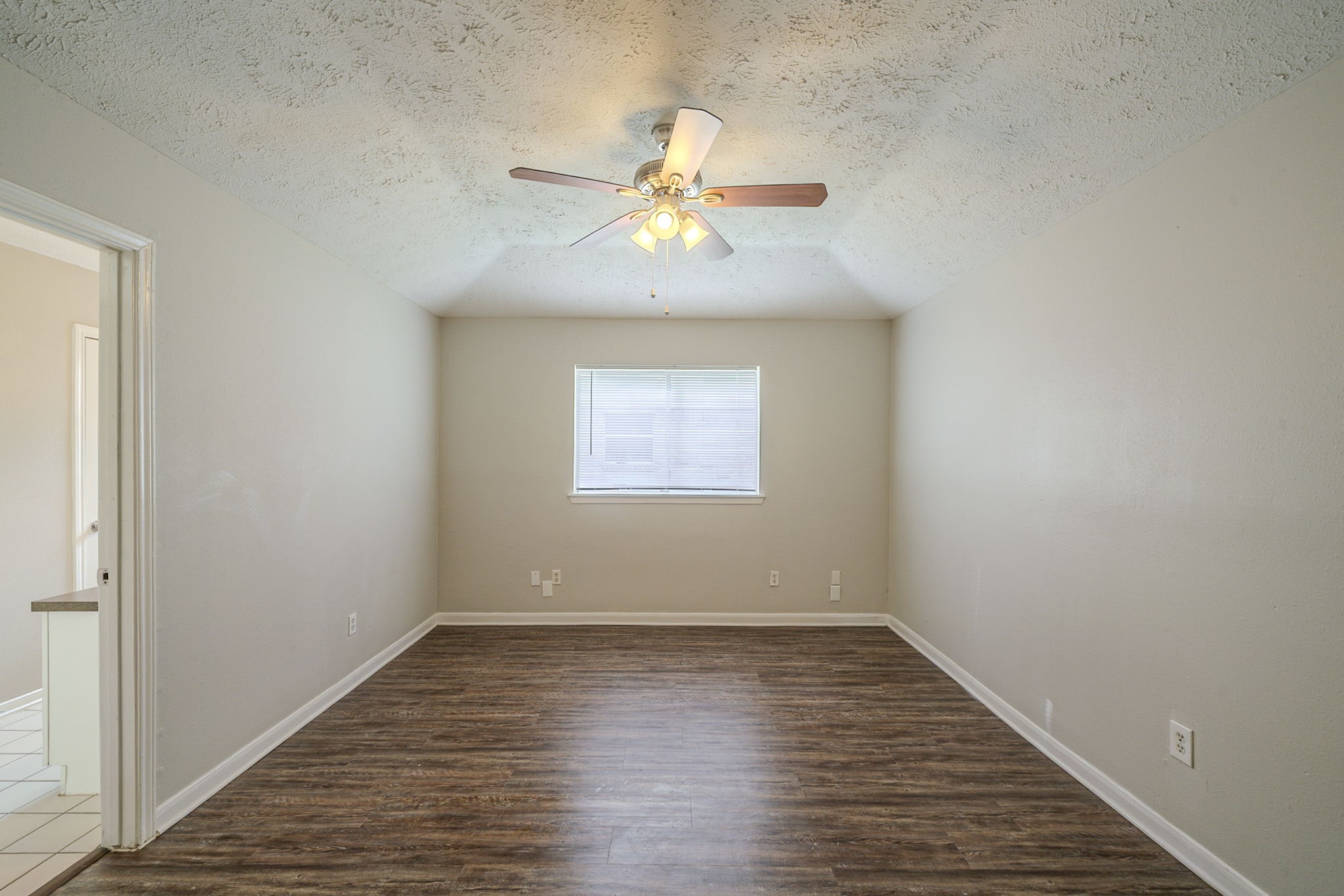4127 Adonis Drive Spring, TX 77373 - Photo 8 of 20 wooden floor in an empty room with a window