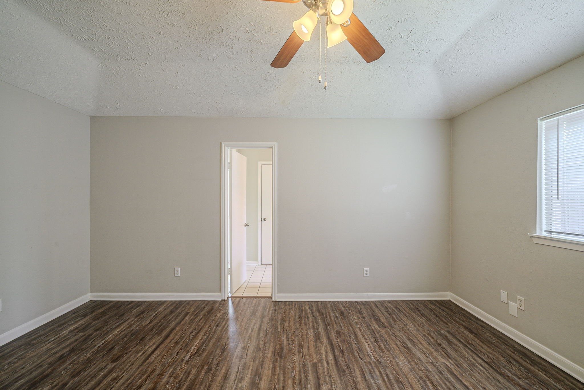 4127 Adonis Drive Spring, TX 77373 - Photo 9 of 20 an empty room with wooden floor and windows