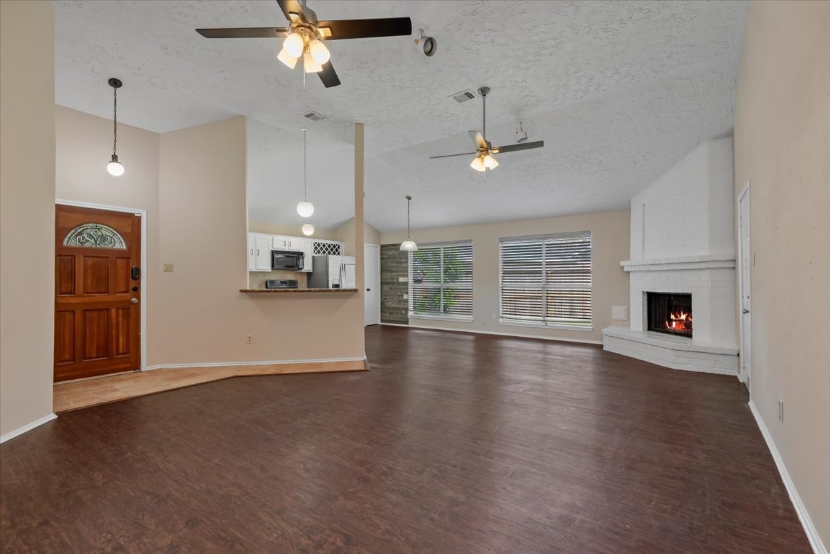 6022 Sean Court Humble, TX 77346 - Photo 3 of 18 an empty room with chandelier fan and windows