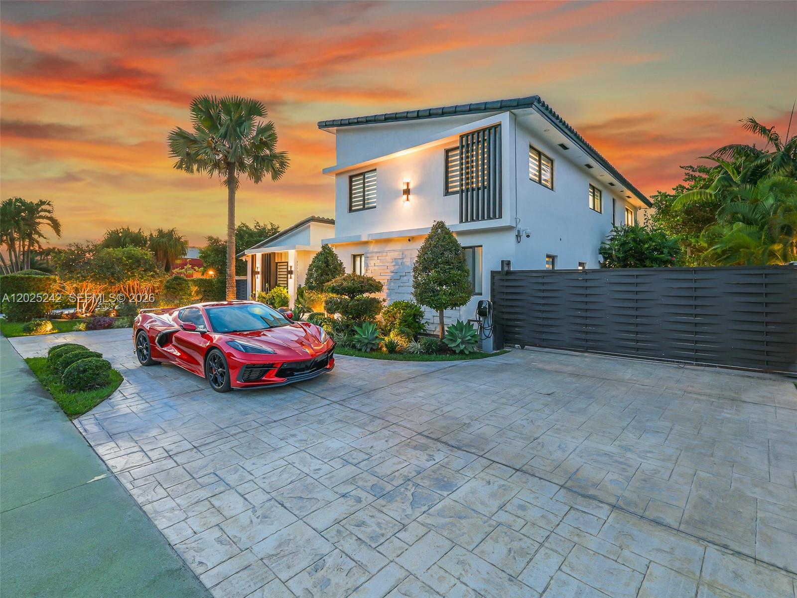 8761 Southwest 56th Street Miami, FL 33165 - Photo 4 of 90 a front view of a house with a yard